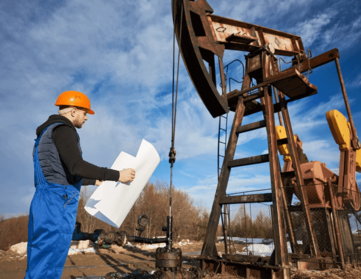 Technician operating geotechnical testing equipment in Northland