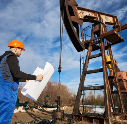 Technician operating geotechnical testing equipment in Northland